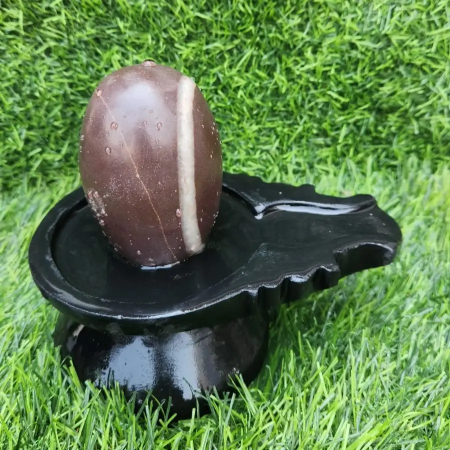 Smooth finish Narmada River Shivling – Energized and certified Shivling with Stone Base